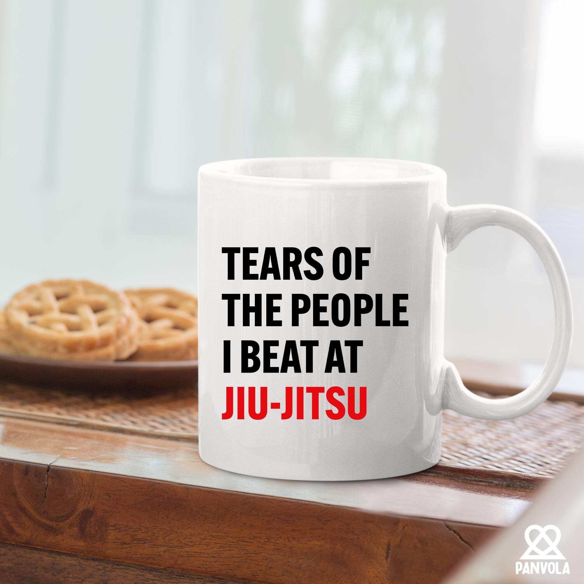 Panvola Tears of the People mug on desk setup