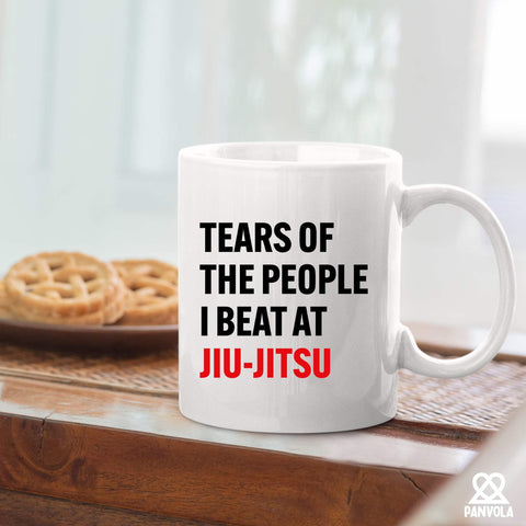 Panvola Tears of the People mug on desk setup