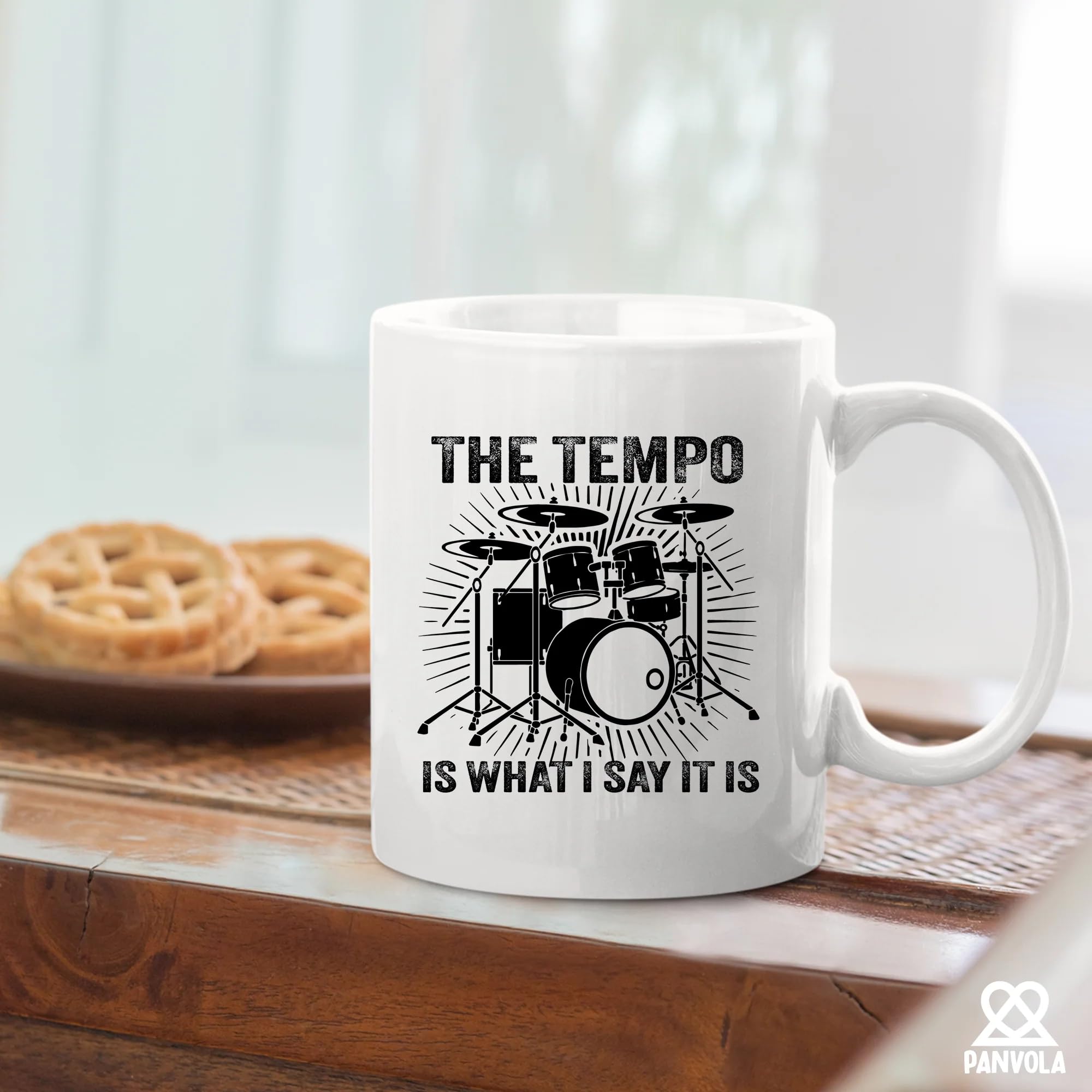 Panvola tempo mug on a desk with notes and headphones