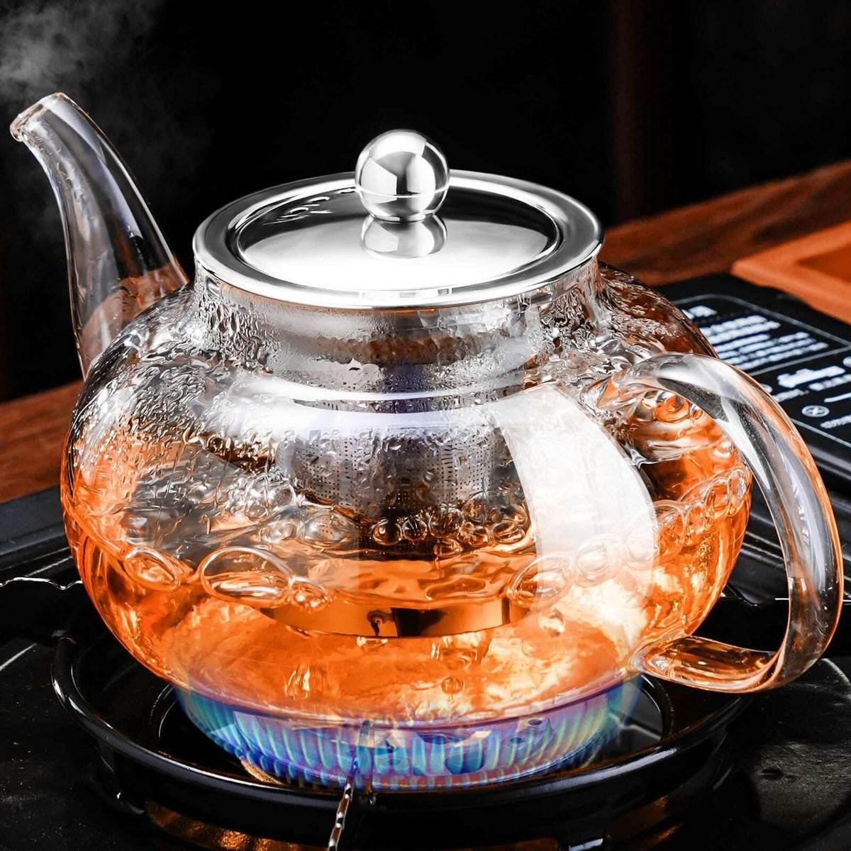 PARACITY glass teapot on stovetop showing heat resistance and clarity