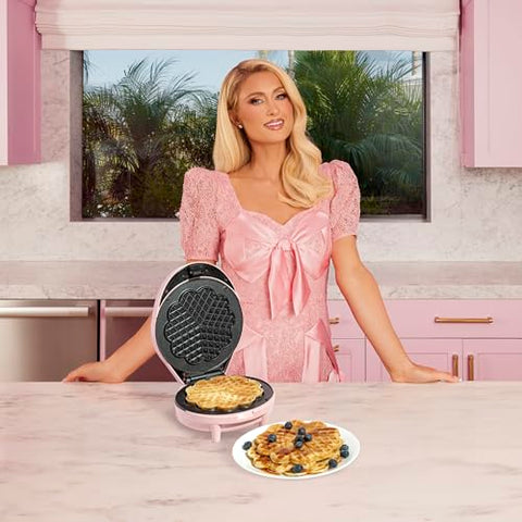 Paris Hilton heart waffle maker cooking five mini heart waffles at once