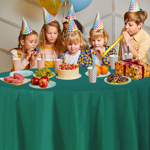 Party Dimensions 84-inch green round tablecloth draped neatly for elegant setup
