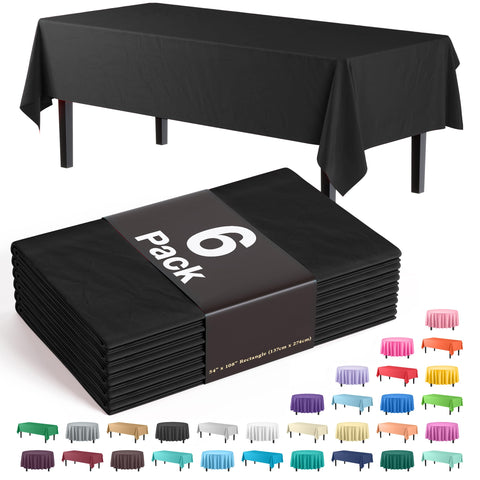 Party Solids 6-pack black 54x108 tablecloth draped over a long banquet table for events.