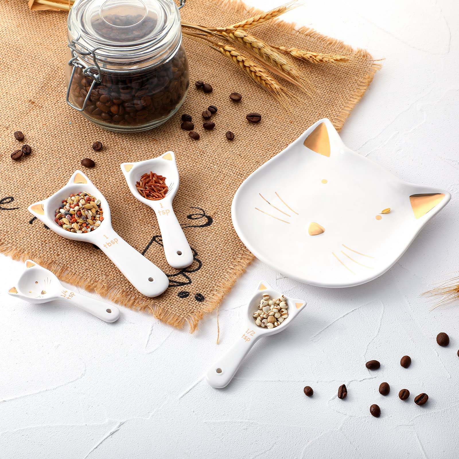Patelai cat spoon holder keeps utensils organized on counter.