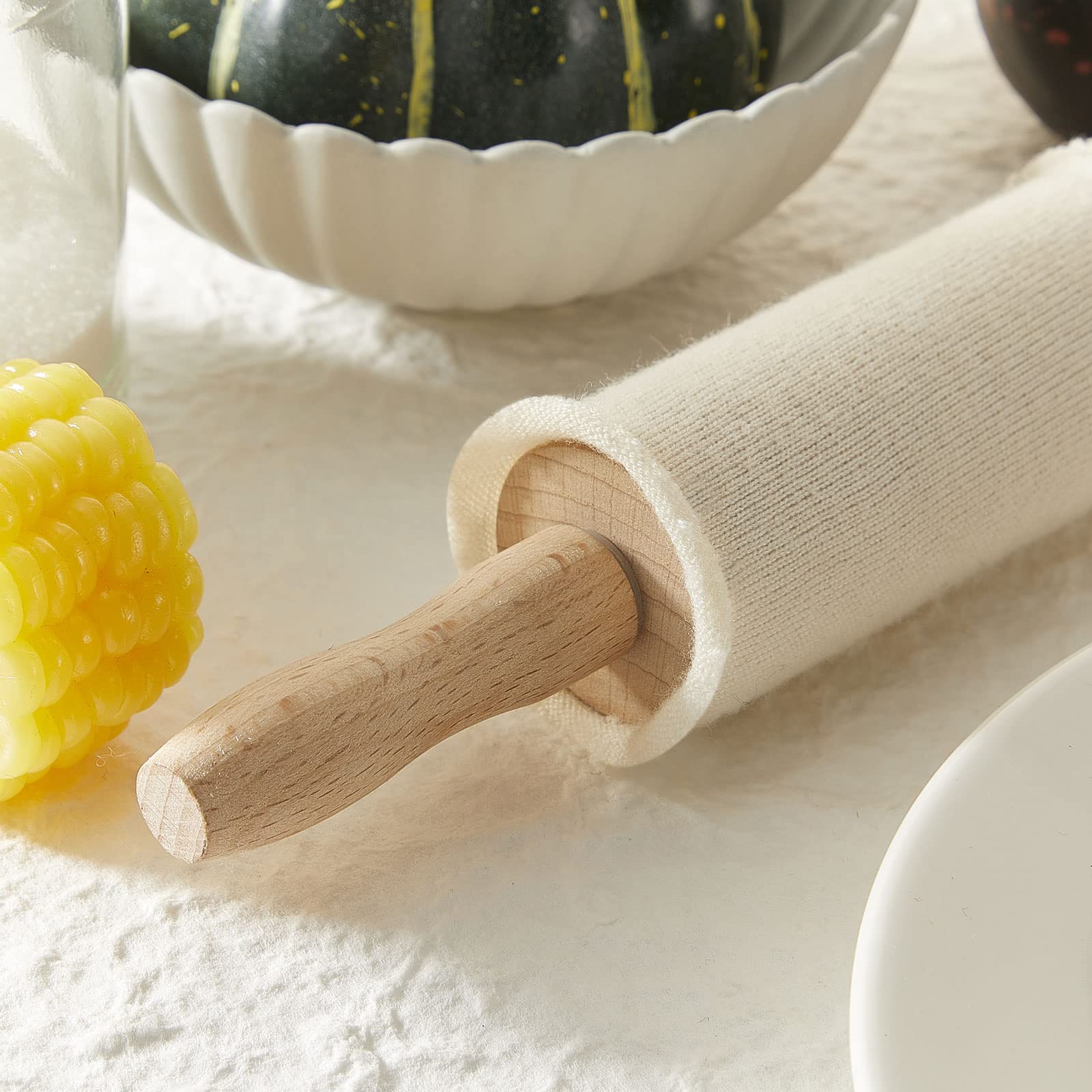 Patelai rolling pin cover shown with dough rolling to reduce sticking.