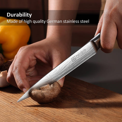 PAUDIN utility knife resting on a kitchen counter for daily prep.