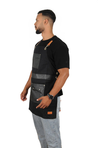 Pelocapa barber apron worn by stylist demonstrates practicality