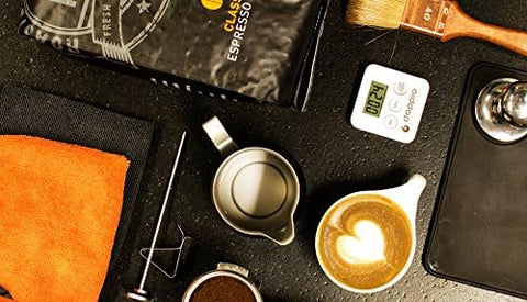 Pendoo Puly Caff Plus espresso cleaner demonstrates foaming action for thorough internal cleaning.