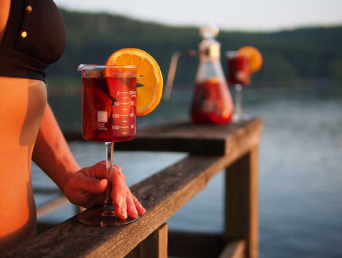 Periodic Tableware lab beaker wine glass on bench showcases versatility for casual gatherings.