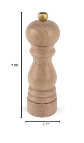 Peugeot Paris table display with natural beechwood grain enhances dining ambiance.