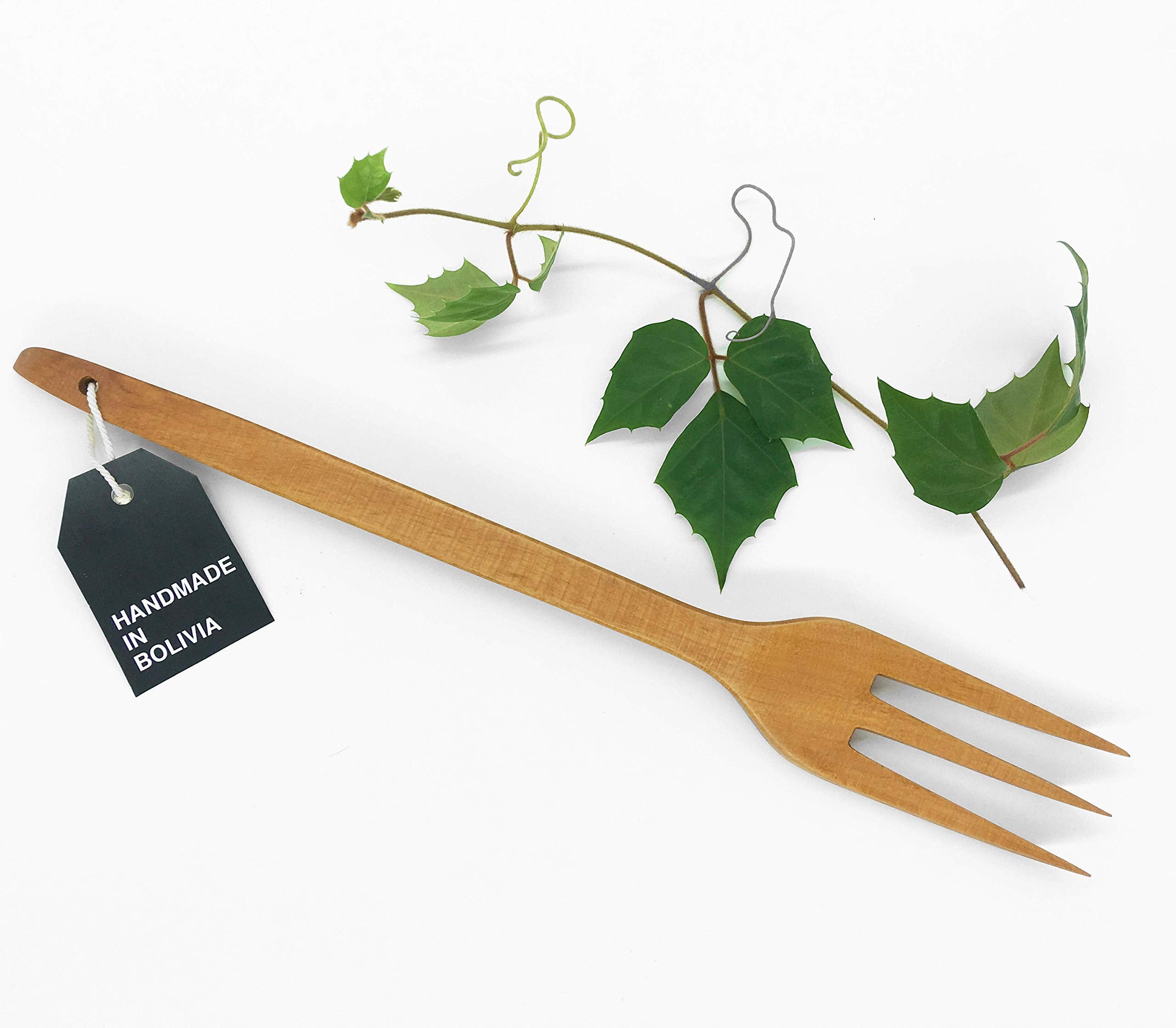 Phai Designs wooden fork three tines in cooking action demonstrating sturdy build