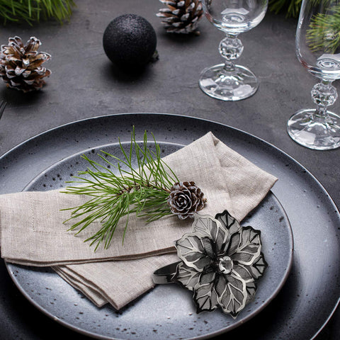 Picowe flower-cutout rings pair with seasonal linens for elegance.