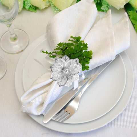 Picowe hollow flower napkin rings enhance wedding dinner table setup.