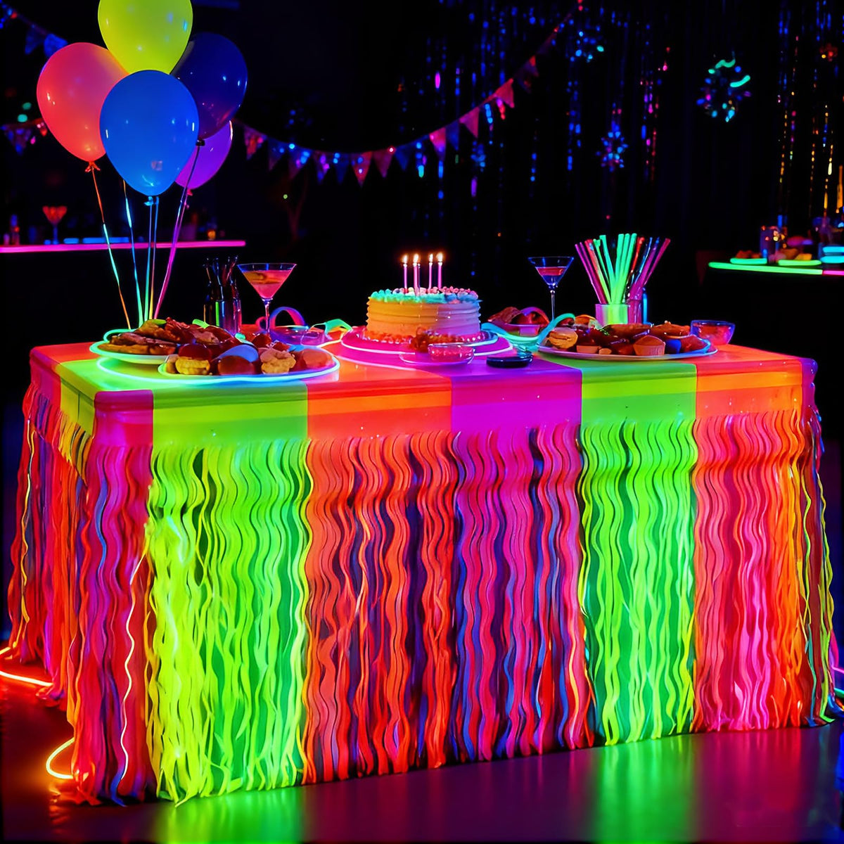 Pigetale glow-foil fringe table skirt in rose red adds UV glow to party tables