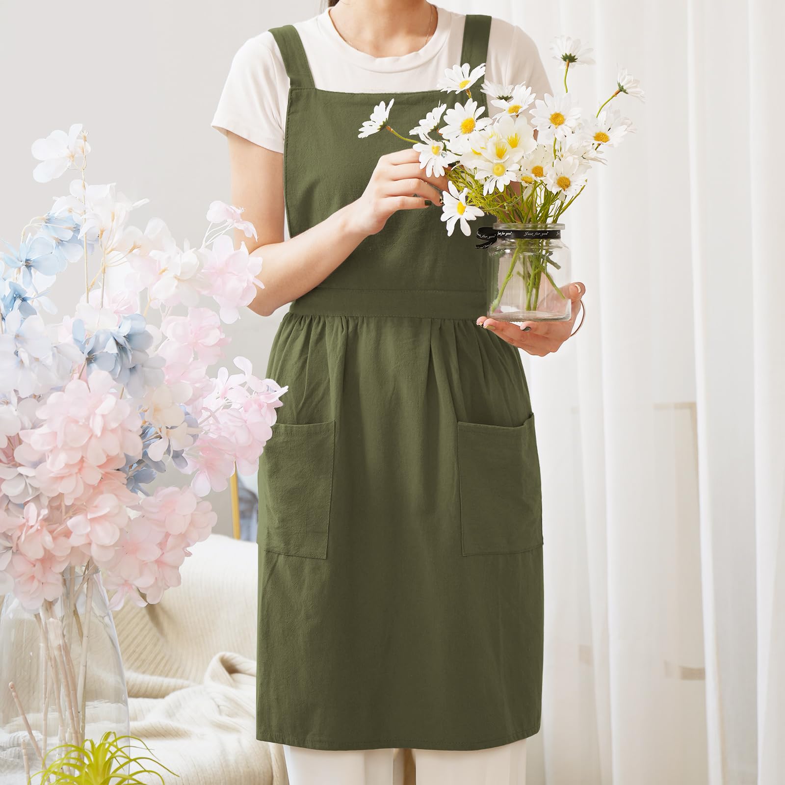 Pinknoke olive green apron chest protection area demonstrates wide coverage for clothes.