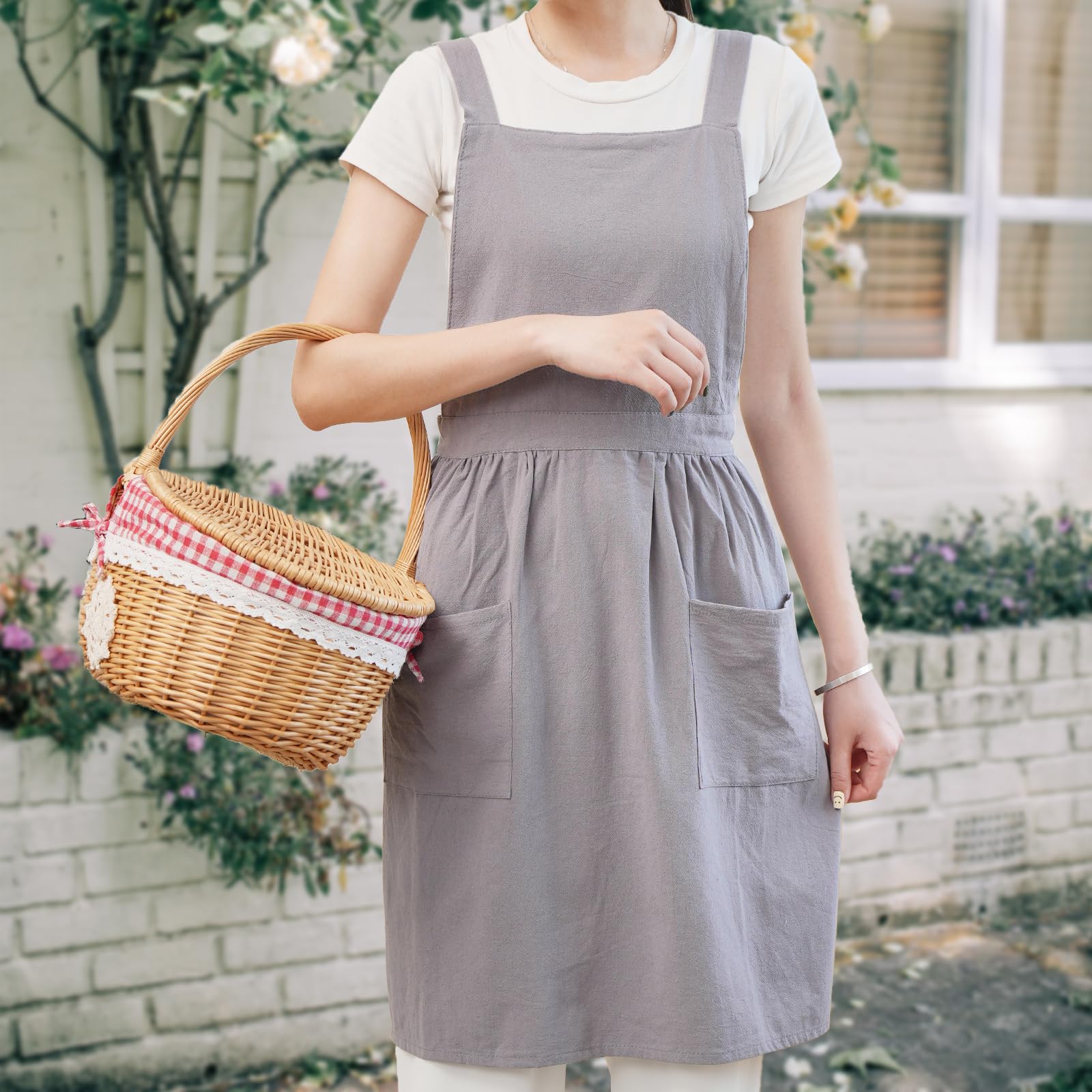 Pinknoke apron gray side view highlights wearable shoulder straps for comfortable all-day use.