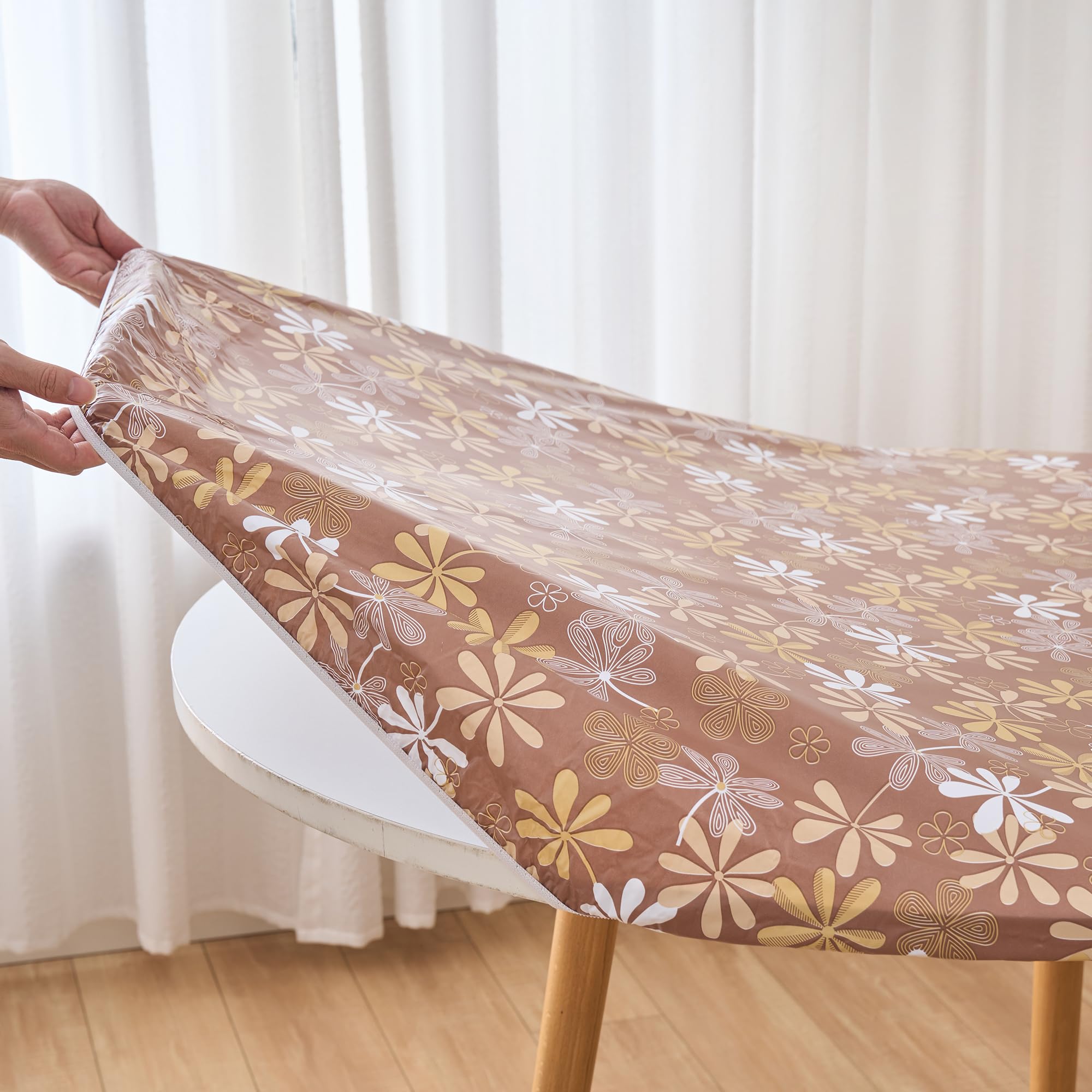 Pioggia easy-clean tablecloth being wiped down after a meal