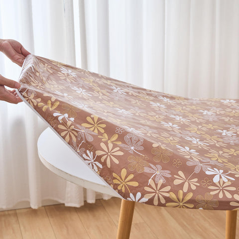 Pioggia easy-clean tablecloth being wiped down after a meal