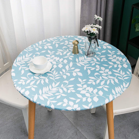 Pioggia flannel-backed tablecloth protecting wood surfaces with a soft backing.
