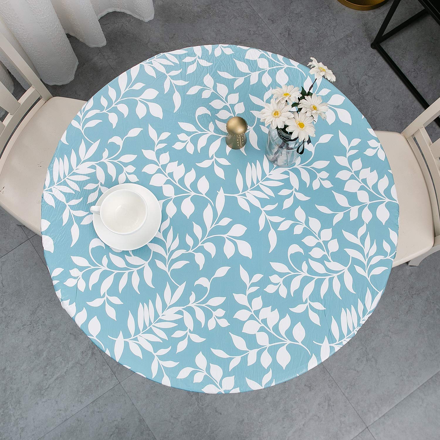 Pioggia round vinyl fitted tablecloth with elastic edge for a secure fit.