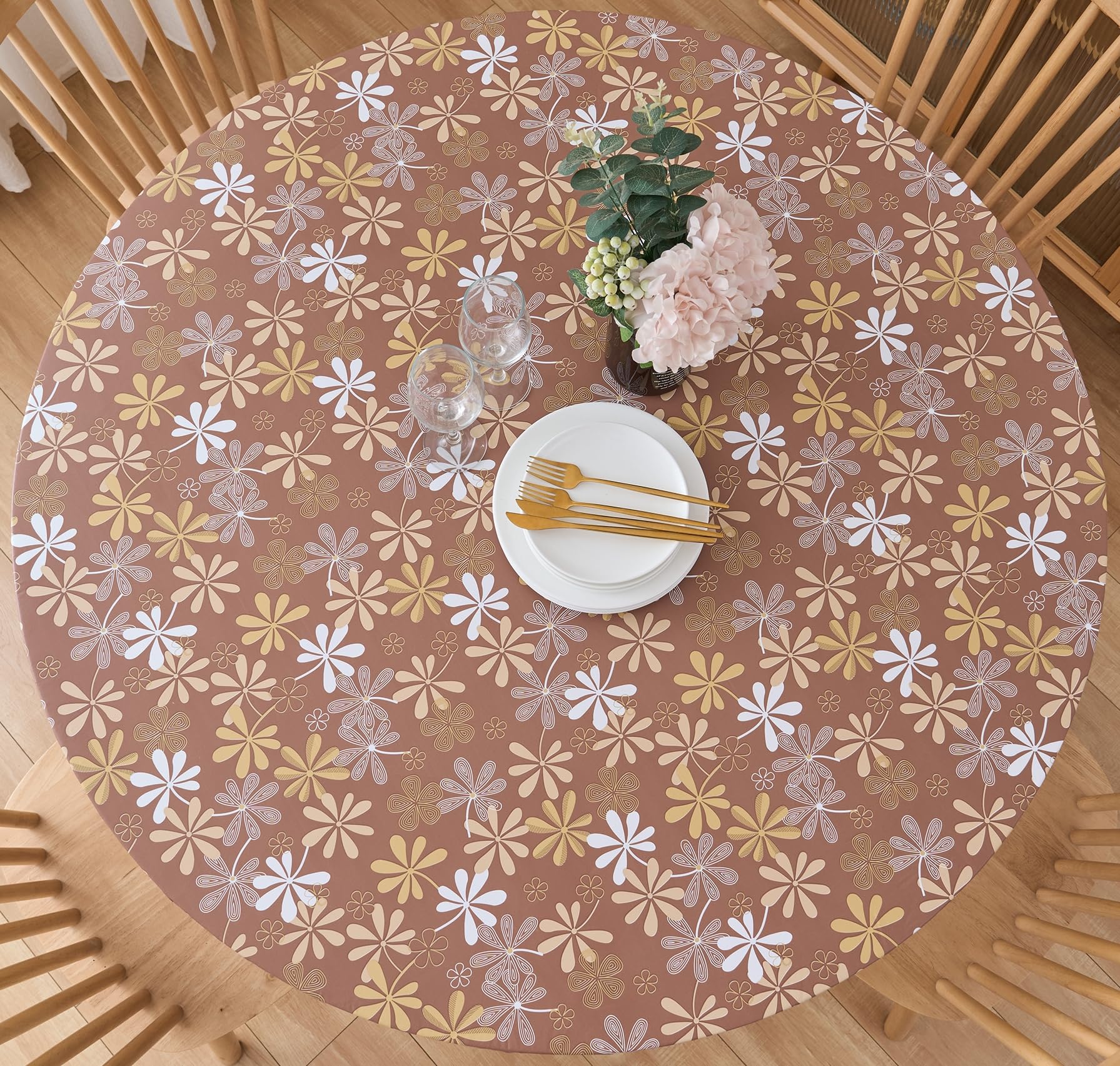 Pioggia round vinyl fitted tablecloth with elastic edge securing a 37-44 inch round table for meals