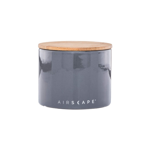 Small 4-inch AirScape canister shown with whole coffee beans on counter