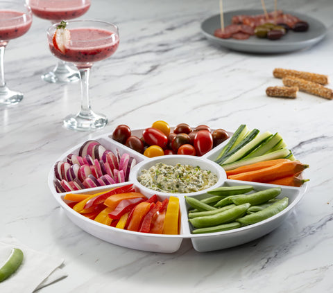 Plasticpro 6-sectional platter with center dip for appetizers and dips.