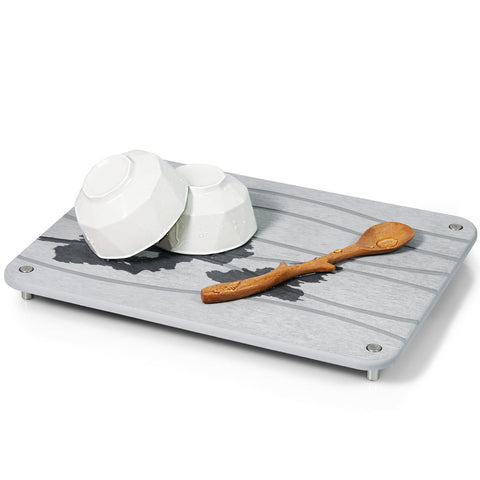 Multi-use Plentio mat supports plants, pet bowls, and fruit.