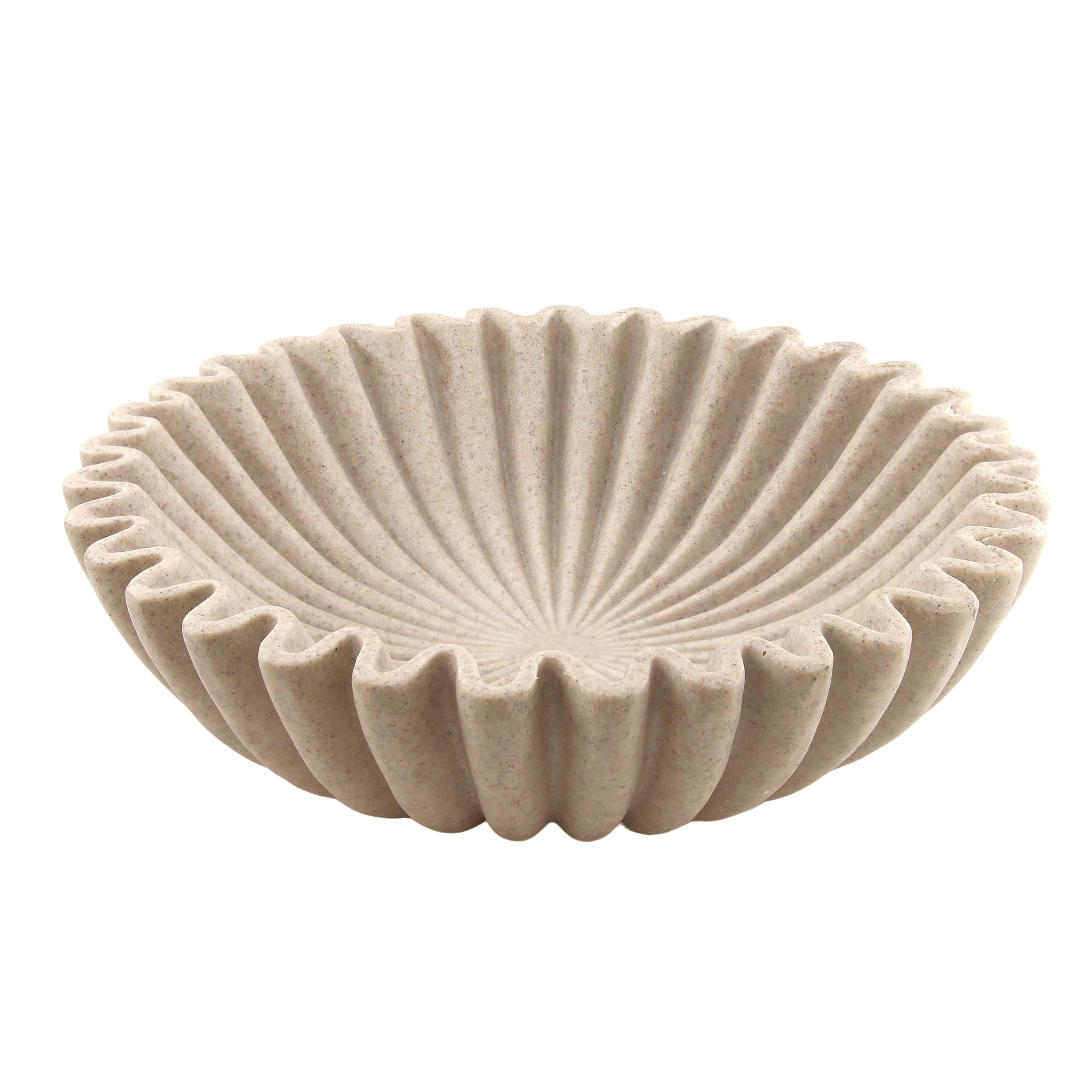 Plukers large beige ruffle bowl on coffee table offering elegant texture and organization