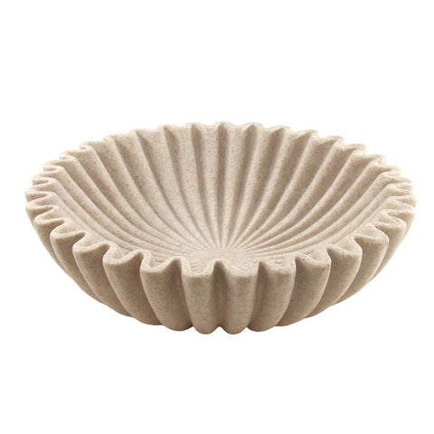 Plukers large beige ruffle bowl on coffee table offering elegant texture and organization