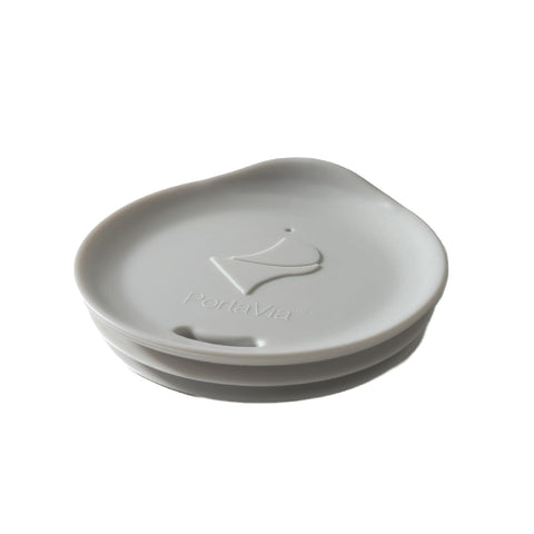 Porta Via silicone lid fits 3- to 3-1/4-inch mugs and keeps beverages hot while commuting.