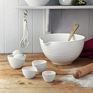Portmeirion Sophie Conran white measuring cups demonstrate dishwasher-safe convenience.