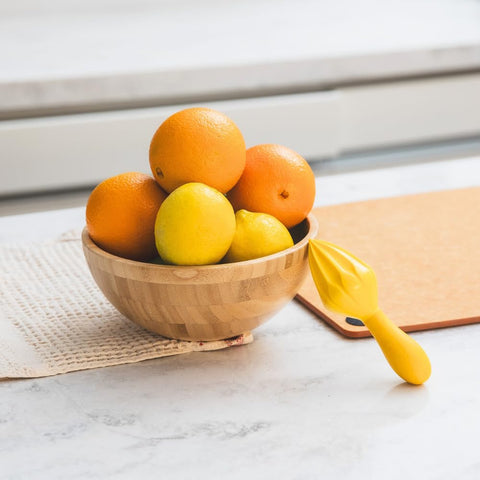 Prepara Juicy Juice Manual Hand Citrus Reamer over pan setup minimizes mess