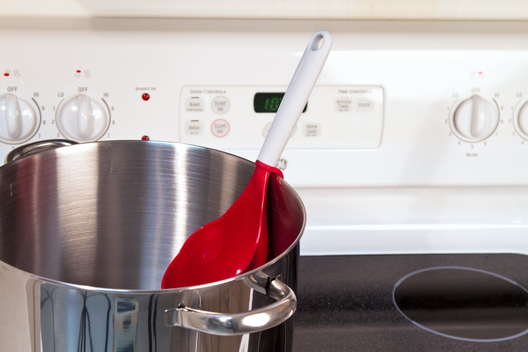 PREPWORKS canning scoop clip-on keeps the utensil secure on the pot rim.