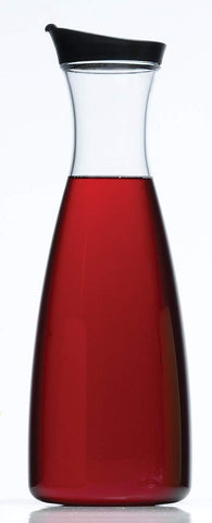 Prodyne acrylic juice carafe in refrigerator door, slim profile saves space.