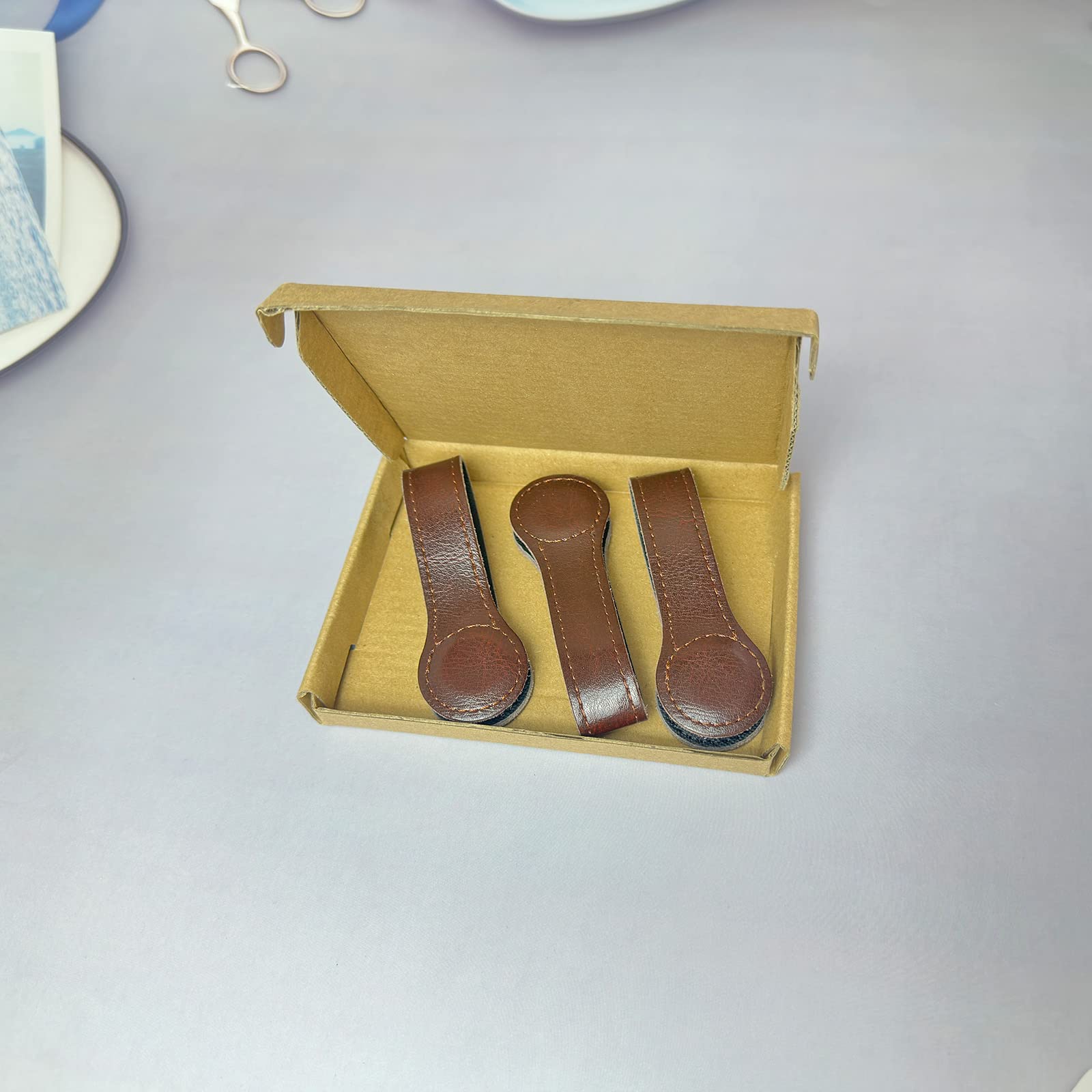 Prriudy three-pack brown leather towel clips for organized kitchen and bath.