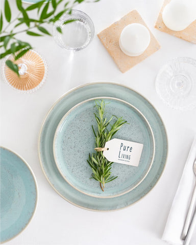 PURE LIVING dessert plates for four in Mediterranean tones; versatile for daily use.