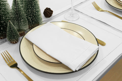 PurpleEssences napkins on dining setup highlight white color elegance for fall gatherings.