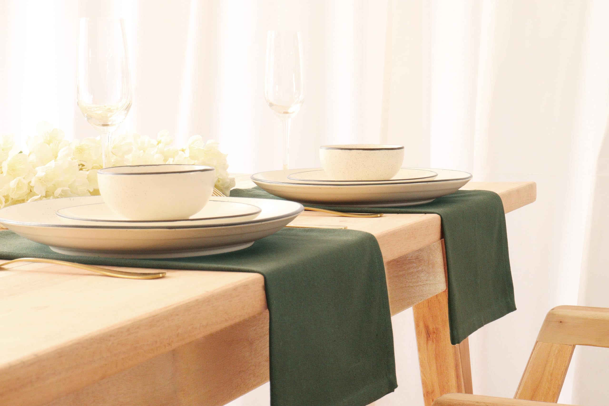 PurpleEssences eco-friendly table linen on a festive setting.