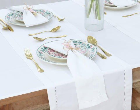 PurpleEssences napkins folded on a table demonstrating crisp edges for weddings.