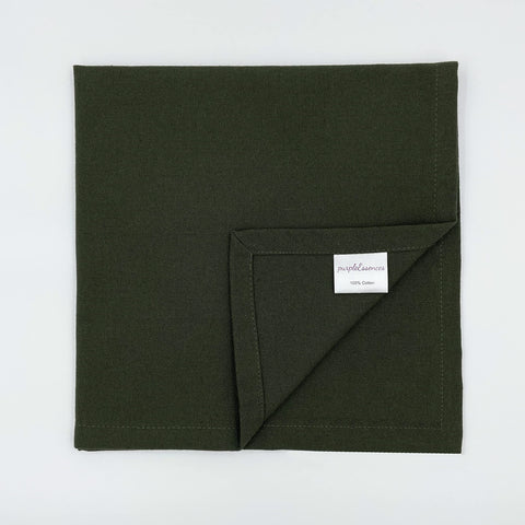 PurpleEssences olive-green napkins complement holiday table decor.