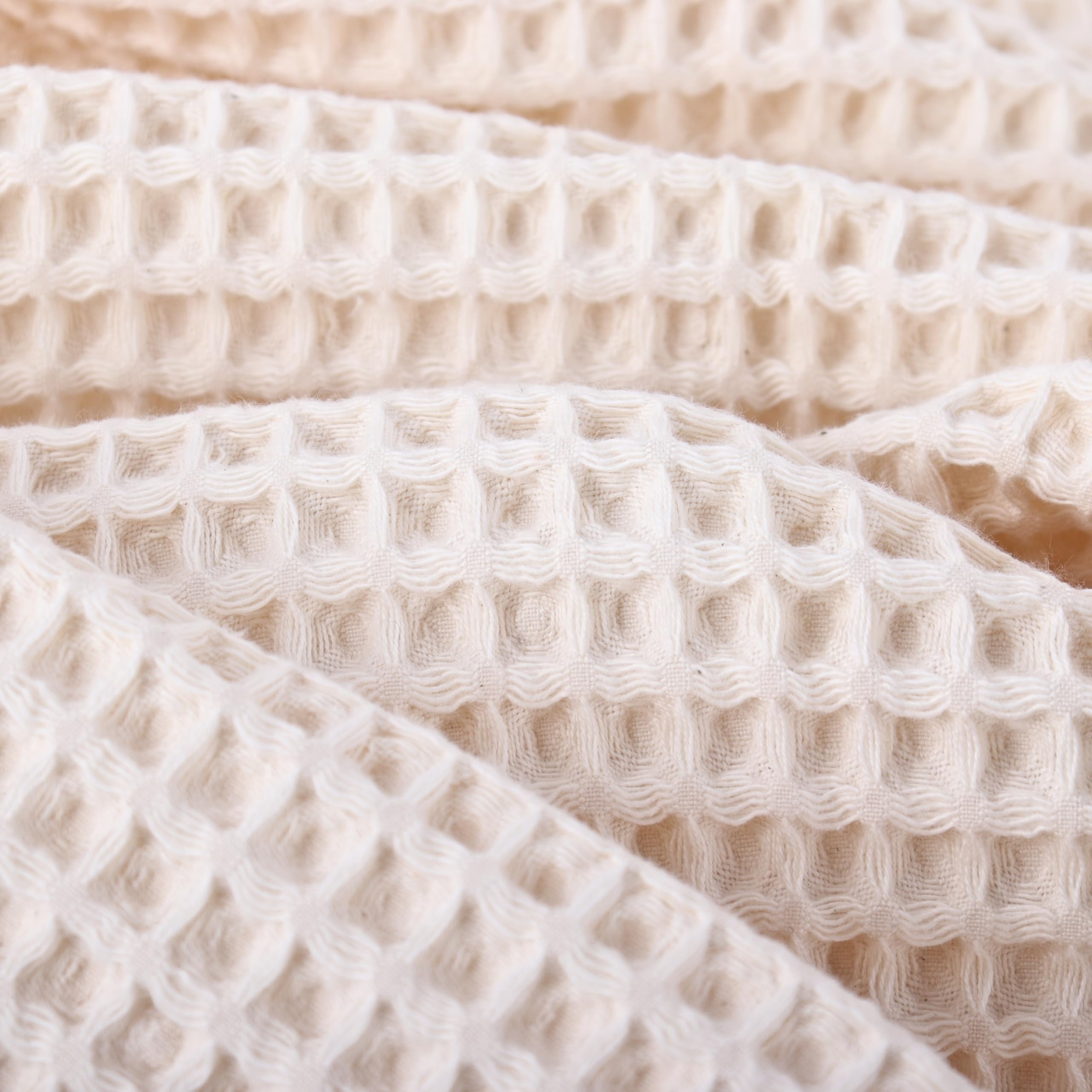 Püskül waffle towels with soft organic cotton texture providing gentle touch.