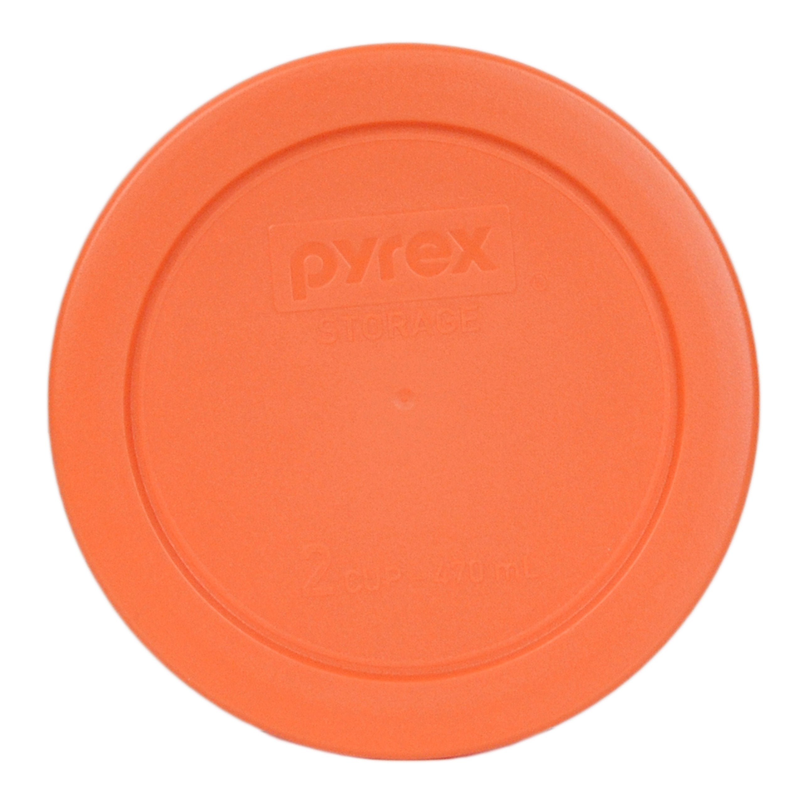 Close-up of Pyrex orange lid fitting a round 2-cup bowl with snug seal
