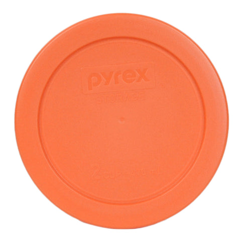 Close-up of Pyrex orange lid fitting a round 2-cup bowl with snug seal