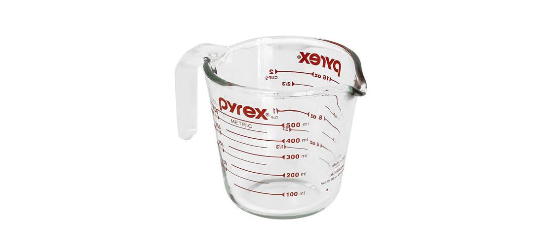 Pyrex Prepware measuring cup with red graphics for accurate ingredient measuring.