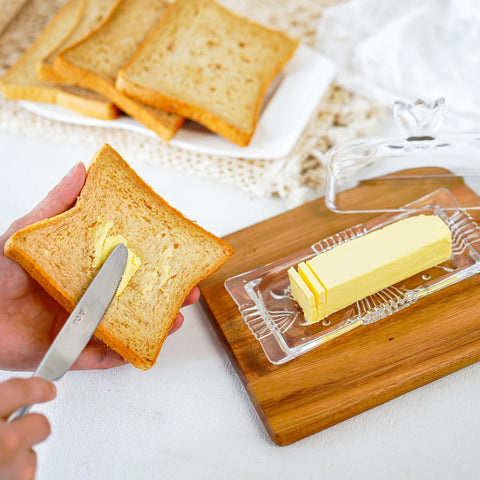 QFkris butter dish on counter adds polished kitchen decor.