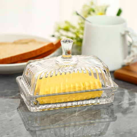 Intricate carvings on the butter dish elevate kitchen decor
