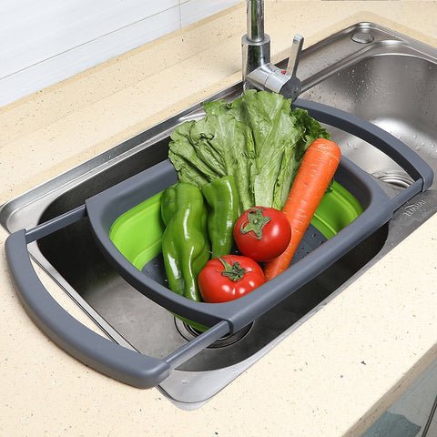 QiMH colander with extendable handles for stable, comfortable draining.
