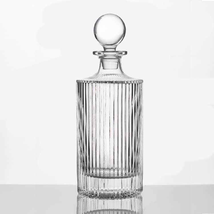 Queenstone whiskey decanter round ribbed design enhances table presentation.
