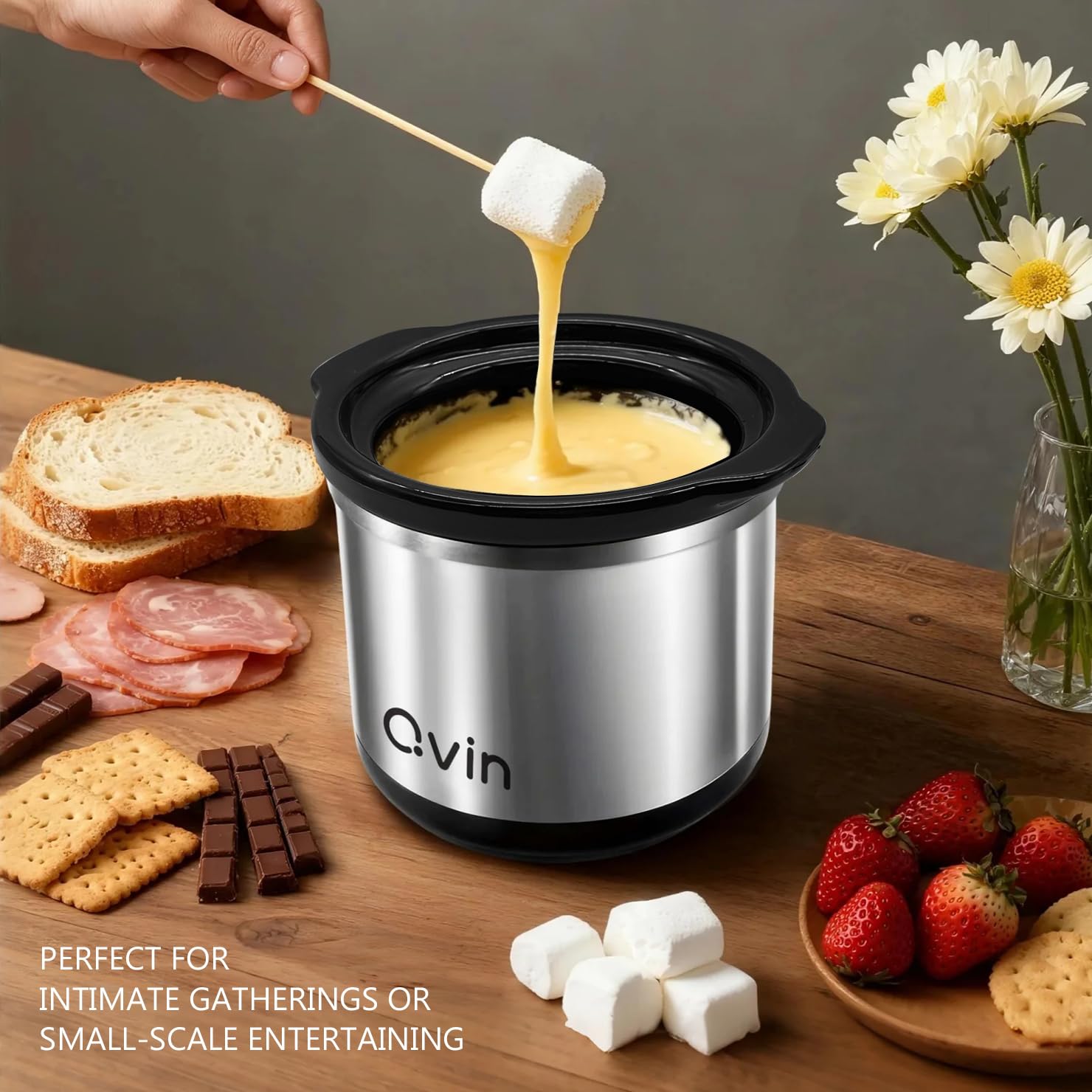 Qvin fondue pot with stainless ring and glass cover for easy viewing.
